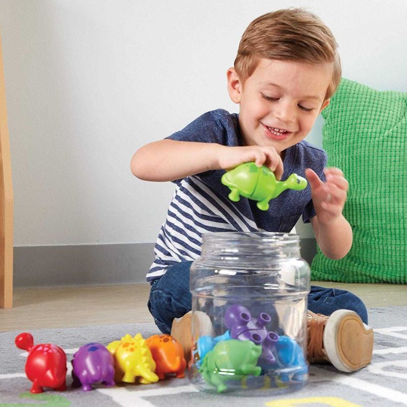 картинка Развивающая игрушка "Собери динозавриков" (серия Snap-N-Learn, 18 элементов) от магазина снабжение школ